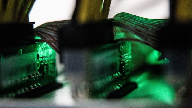 Cables connect to a cryptocurrency mining rig at the HydroMiner GmbH cryptocurrency mining facility near Waidhofen an der Ybbs, Austria, on Friday, Jan. 19, 2018. HydroMiner, the Austrian cryptocurrency miner that mines bitcoins with green energy, is weighing an initial public offering to fund an expansion outside its home country. 