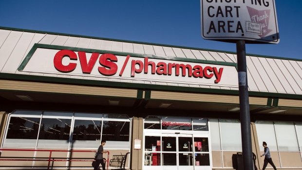 Pedestrians walk past a CVS Health Corp. store in Oakland, California, U.S., on Friday, Aug. 2, 2019.