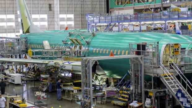 A nearly completed Boeing Co. 777 reaches the end of a moving production line at the company's facility in Everett, Washington. 