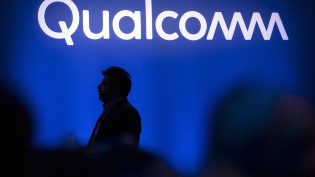 Nakul Duggal, senior vice president of automotive product management at Qualcomm Technologies Inc., is silhouetted while speaking during the company's news conference at the 2019 Consumer Electronics Show (CES) in Las Vegas, Nevada, U.S., on Monday, Jan. 7, 2019. The company’s chips will be in 30 devices with 5G connections coming to the market later in 2019, Qualcomm said Monday at the annual CES show in Las Vegas. 