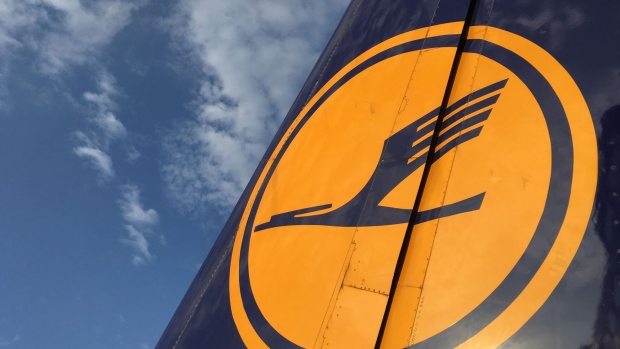 The Deutsche Lufthansa AG logo sits on the tail fin of a passenger jet as it sits on the tarmac at Frankfurt Airport, operated by Fraport AG, in Frankfurt, Germany, on Monday, Sept. 26, 2016. Lufthansa is nearing an agreement to operate airplanes now flying under the Air Berlin Plc banner, according to two people with knowledge of the matter, letting Lufthansa bolster its discount flights as Air Berlin cuts back its routes. 