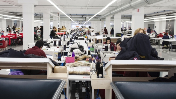 Employees sew jackets at the new Canada Goose Inc. manufacturing facility in Montreal, Quebec, Canada, on Monday, April 29, 2019. The facility is Canada Goose's second factory in Quebec and eighth wholly-owned facility in Canada. Photographer: Christinne Muschi/Bloomberg