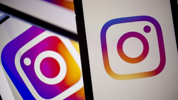 The Facebook Inc. Instagram logo is displayed on an Apple Inc. iPhone in an arranged photograph taken in Arlington, Virginia, U.S. on Monday, April 29, 2019. Facebook's sales gains are increasingly being driven by photo-sharing app Instagram and advertising in its Stories feature, a Snapchat copycat. 