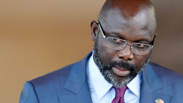 Liberia's President George Weah addresses a press conference with the Ivorian President following a meeting at the Presidential Palace in Abidjan on April 4, 2018. 