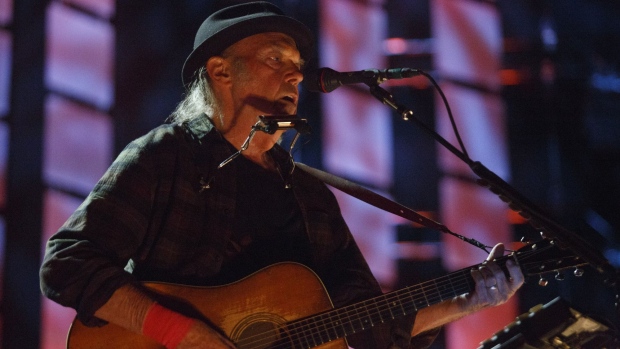 Musician Neil Young performs during the Farm Aid festival in East Troy, Wisconsin, U.S., on Saturday, Sept. 21, 2019. Since 1985, Farm Aid has raised $57 million to promote a strong and resilient family farm system of agriculture. 
