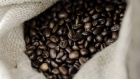 Coffee beans sit in a hessian sack inside the Carte Noire factory in Laverune, France, on Tuesday, May 16, 2017.