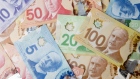 Canadian dollar banknotes are displayed in an arranged photograph in Toronto, Canada. Bloomberg/Bren