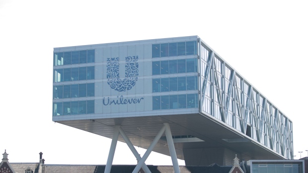 The Unilever logo sits on the Unilever NV headquarter offices in Rotterdam, Netherlands, on Thursday, May 11, 2017. Unilever Plc's announcement that it's looking at ending its dual nationality and basing itself in London or Rotterdam means Theresa May finds her Brexit strategy facing either a big endorsement or an early blow. 
