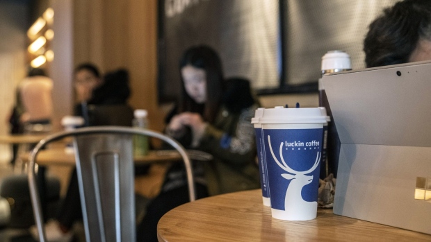 Coffee beverages sit on a table at a Luckin Coffee outlet in Beijing, China, on Tuesday, Jan. 15, 2019. Luckin, the Chinese startup that's banking on selling cappuccinos to on-the-go office workers, is spending millions of dollars a year opening outlets to unseat Starbucks Corp. as the top java seller in the country. 