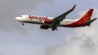 A SpiceJet Ltd. aircraft prepares to land at Chhatrapati Shivaji International Airport in Mumbai, India, on Monday, July 10, 2017. India, which was the world’s fastest growing aviation market last year, is crucial for planemakers like Boeing Co. and Airbus SE, as airlines see increased demand from the rising middle class. 