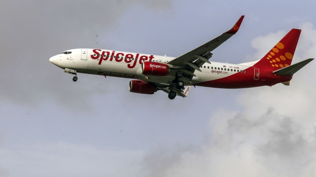 A SpiceJet Ltd. aircraft prepares to land at Chhatrapati Shivaji International Airport in Mumbai, India, on Monday, July 10, 2017. India, which was the world’s fastest growing aviation market last year, is crucial for planemakers like Boeing Co. and Airbus SE, as airlines see increased demand from the rising middle class. 