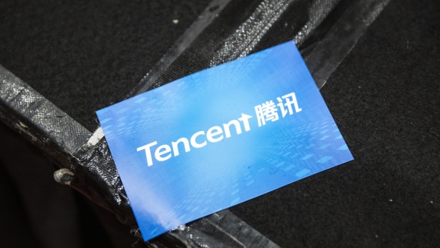 A sticker featuring the logo of Tencent Holdings Ltd. is seen during a news conference in Hong Kong, China, on Thursday, March 21, 2019. Tencent posted a quarterly profit that missed analysts’ estimates after it spent heavily on cloud and mobile payments businesses to offset a gaming slowdown. 