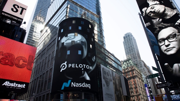 The Peloton logo is displayed, centre, on the Nasdaq MarketSite, Sept. 26, 2019 in Times Square