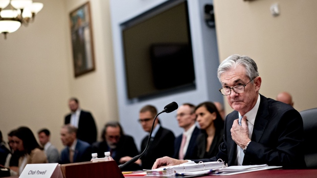 Jerome Powell, chairman of the U.S. Federal Reserve, adjusts his tie before a House Budget Committee