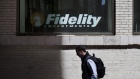A pedestrian passes a Fidelity Investments branch in New York, U.S. 