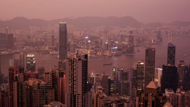 Buildings are seen from Victoria Peak at dusk in Hong Kong, China, on Wednesday, Aug. 28, 2019. Hong Kong's hotel industry is struggling with a collapse in bookings after thousands of protesters shut down flights from the territory's airport in an escalation of months of clashes with police. 