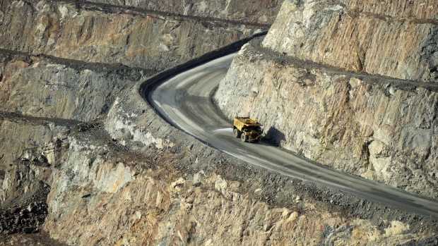 A dump truck travels along an access ramp at the Fimiston Open Pit mine, known as the Super Pit operated by Kalgoorlie Consolidated Gold Mines Ltd. (KCGM), in Kalgoorlie-Boulder, Western Australia, Australia, on Wednesday, Aug. 8, 2018. Gold miners in Australia, the industry's most profitable operators, are facing a slump in output that’ll leave the nation trailing key rivals -- and they’re being warned to resist the temptation to replace fading mines with high-cost production. 