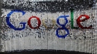 A sign featuring Google Inc.'s logo stands inside the entrance to their new U.K. headquarters at Six St Pancras Square in London, U.K., on Tuesday, June 21, 2016. The owner of the world's largest search engine built its new U.K. headquarters on 2.4 acres (1 hectare) of land that's part of a larger development by King's Cross Central LP near the Eurostar rail link to mainland Europe. 