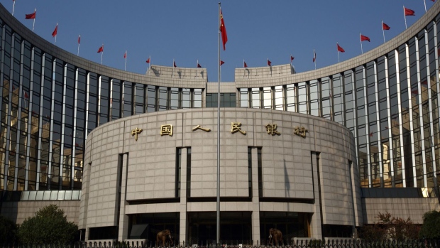 The People's Bank Of China (PBOC) headquarters stands in the financial district of Beijing, China, on Saturday, Nov. 8, 2014. The yuan strengthened after China's trade surplus approached a record and the central bank raised the yuan's reference rate by the most since June 2010. Photographer: Tomohiro Ohsumi/Bloomberg