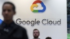 Attendees pass in front of a logo during the Google Cloud Next '19 conference in San Francisco, California, U.S., on Tuesday, April 9, 2019. The conference brings together industry experts to discuss the future of cloud computing. 