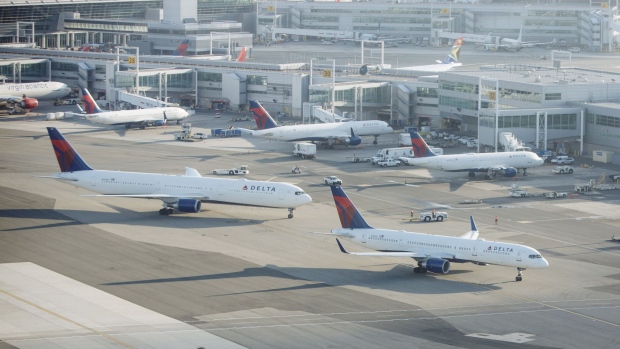 Delta Air Lines Inc. planes stand at John F. Kennedy International Airport (JFK) in New York, U.S., on Thursday, July 5, 2018. Delta Air Lines Inc is scheduled to release earnings figures on July 12. 