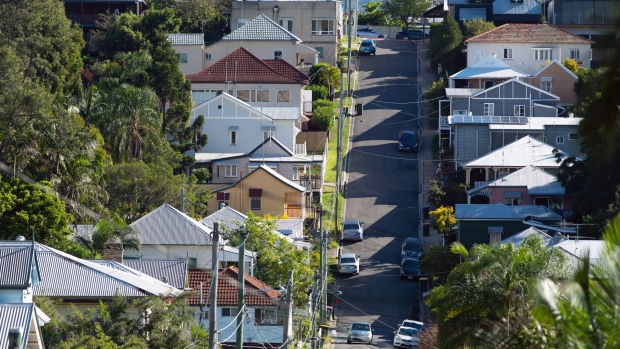 Residential properties stand along a street in Brisbane, Australia, on Tuesday, May 7, 2019. Australian central bank chief Philip Lowe dashed expectations of an interest-rate cut, looking through recent weakness in inflation to hitch the policy outlook to a labor market that he says remains strong. 