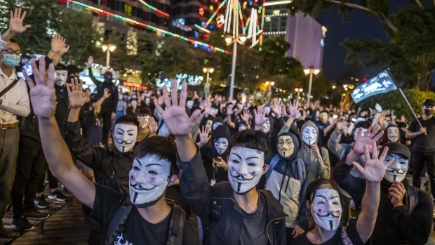 Demonstrators wear anonymous masks, also known as Guy Fawkes masks, during a protest on Nov. 5. 
