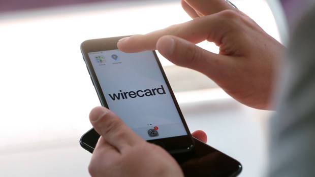 An employee demonstrates the Wirecard AG online payment smartphone app on the company's exhibition stand at the Noah Technology Conference in Berlin, Germany, on Thursday, June 13, 2019. The annual tech conference runs June 13 -14 and brings together future-shaping executives and investors. 