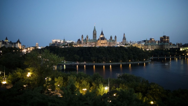 Parliament Hill stands at night in Ottawa, Ontario, Canada, on Thursday, Aug. 16, 2018. It makes sense for the U.S. and Mexico to meet bilaterally on Nafta on certain issues and Canada looks forward to rejoining talks on the trilateral pact in the coming days and weeks, Prime Minister Justin Trudeau said. 