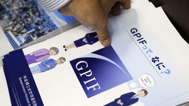 The Government Pension Investment Fund (GPIF) logo is displayed on a brochure ahead of a news conference in Tokyo, Japan, on Friday, July 5, 2019. The world's biggest pension fund posted a gain for a third consecutive fiscal year as overseas stocks rallied and strength in the dollar versus the yen helped boost the value of its assets abroad. 