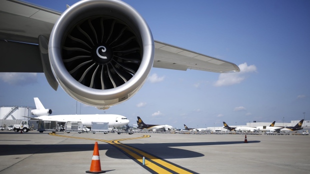 A Rolls Royce Holdings Plc jet engine sits beneath the wing of an Airbus SE A380 passenger jet, operated by Emirates Airline, on static display on the first day of the 16th Dubai Air Show at Dubai World Central (DWC) in Dubai, United Arab Emirates, on Sunday, Nov. 17, 2019. The Dubai Air Show is the biggest aerospace event in the Middle East, Asia and Africa and runs Nov. 17 - 21. 