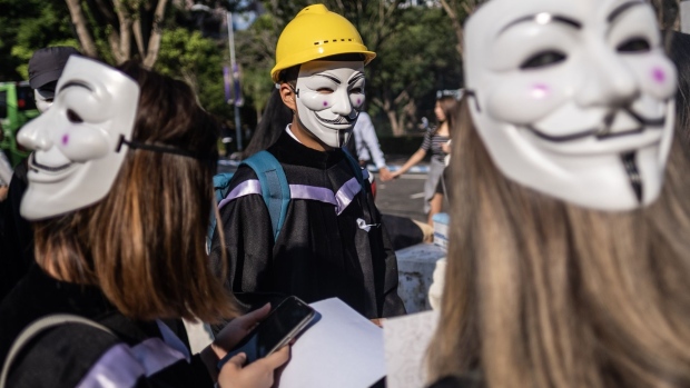 Graduates wearing masks protest ahead of a graduation ceremony at the Chinese University of Hong Kong. 