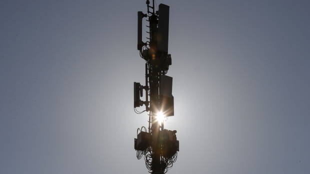 A Swisscom AG network mast, equipped with 5G apparatus, stands on a roof of a Swisscom building in Bern, Switzerland, on Thursday, July 4, 2019. Nokia and Ericsson—fierce rivals themselves—have recently wrested notable long-term deals from Huawei to build 5G wireless networks, to enable everything from autonomous cars to robot surgery. 