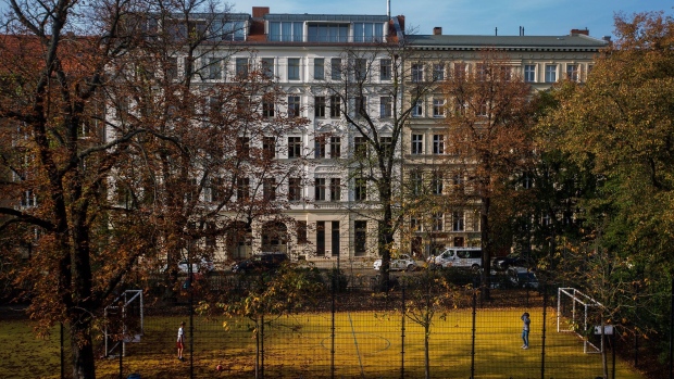 People play football in a park surrounded by residential apartment buildings in the Prenzlauer Berg district of Berlin, Germany, on Wednesday, Oct. 23, 2019. Berlin’s governing parties struck a deal to freeze rents for five years, marking one of the most radical plans to tackle spiraling housing costs in a major city and hitting the shares of major apartment owners. 
