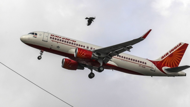 An Air India Ltd. aircraft prepares to land at Chhatrapati Shivaji International Airport in Mumbai, India, on Monday, July 10, 2017. Air India’s local market share has shrunk to about 13 percent from 35 percent just a decade ago. 