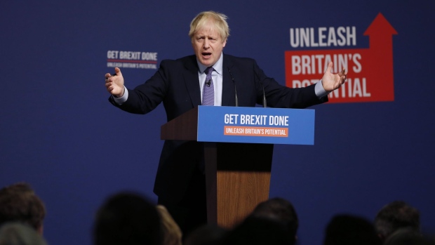 Boris Johnson, U.K. prime minister, gestures as he speaks at the Conservative Party's manifesto launch in Telford, U.K. on Sunday, Nov. 24, 2019.
