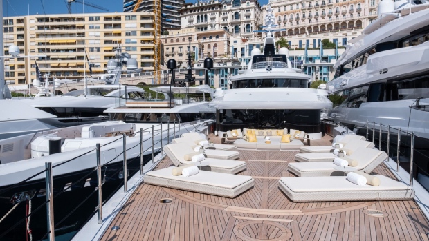 Upholstered sun loungers sit on a prow deck area of luxury superyacht Metis, manufactured by Azimut Benetti SpA, as sits moored between other vessels during the Monaco Yacht Show (MYS) in Port Hercules, Monaco, on Wednesday, Sept. 25, 2019. The MYS features 125 luxury superyachts and runs from Sept. 25 - 28. 