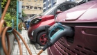 A Baojun E100 electric vehicle stands plugged in to a charging station outside a SAIC-GM-Wuling Automobile Co. Baojun E100 Customer Experience Center, a joint venture between SAIC Motor Corp., General Motors Co. and Liuzhou Wuling Automobile Industry Co., in Liuzhou, Guangxi province, China, on Wednesday, May 23, 2018. GM and its partners sold 4 million vehicles in China in 2017, about 1 million more than the automaker sold in the U.S. 