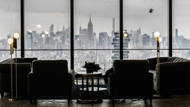 The Manhattan skyline is seen past furniture displayed on the 68th floor during a tour of the 3 World Trade Center (WTC) building in New York, U.S., on Tuesday, May 22, 2018. 3 World Trade Center is slated to open June 6 and will feature 2.5 million rentable square feet of space, 64 foot high office lobby, and 150,000 square feet of retail on five floors. 