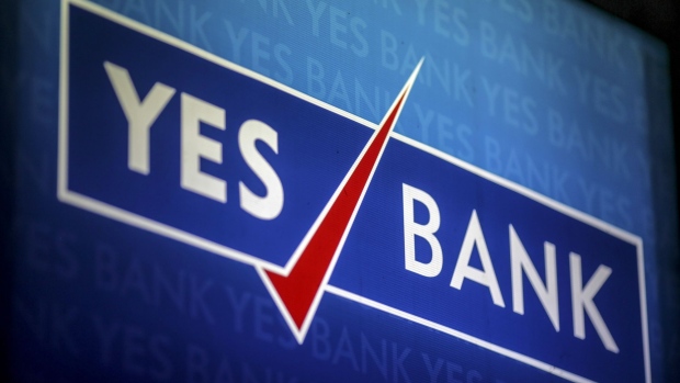 Signage for Yes Bank Ltd. is displayed at a branch in Mumbai, India, on Tuesday, April 30, 2018. Shares of Yes Bank slumped 29 percent on Tuesday, its biggest decline on record after the lender headed by newly appointed Chief Executive Officer Ravneet Gill reported a surprise quarterly loss. 