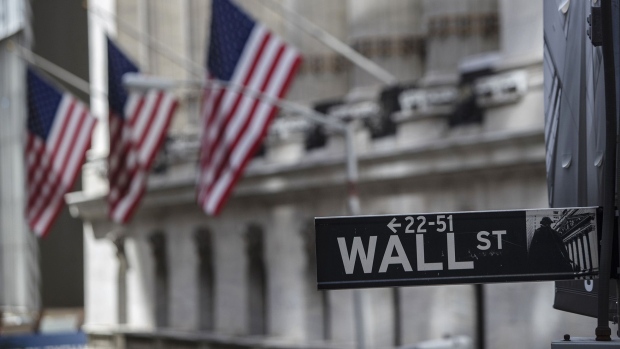 A Wall Street sign hangs in front of the New York Stock Exchange (NYSE) in New York. 