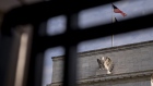 An American flag flies outside the Marriner S. Eccles Federal Reserve building in Washington, D.C., U.S., on Wednesday, July 31, 2019. The Federal Reserve is widely expected to lower interest rates by a quarter-point at its meeting that concludes Wednesday and leave the option open for additional moves despite demands by President Donald Trump for a "large" rate cut. 