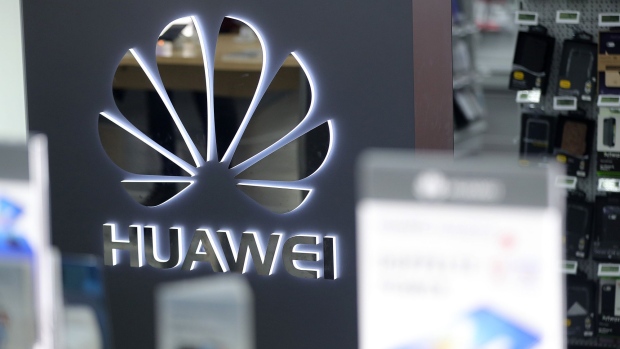 The logo of Huawei Technologies Co. Ltd. is seen on a sign at a pop-up office ahead of the World Economic Forum (WEF) in Davos, Switzerland, on Monday, Jan. 21, 2019. World leaders, influential executives, bankers and policy makers attend the 49th annual meeting of the World Economic Forum in Davos from Jan. 22 - 25. 