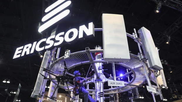 A tower climber hangs from a display of 5G wireless radio antennas at the Telefonaktiebolaget LM Ericsson booth during the Mobile World Congress Americas event in Los Angeles, California, U.S., on Wednesday, Oct. 23, 2019. The conference features prominent executives representing mobile operators, device manufacturers, technology providers, vendors and content owners from across the world. 