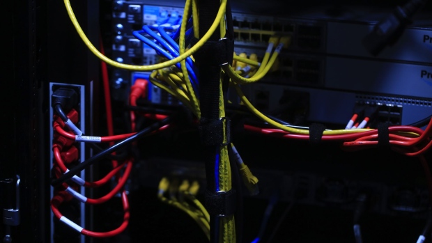 Colored wires connect a computer server at the CeBIT 2017 tech fair in Hannover, Germany, on Monday, March 20, 2017. Leading edge technologies in the digital world are showcased in this annual event which runs March 20 - 24. 