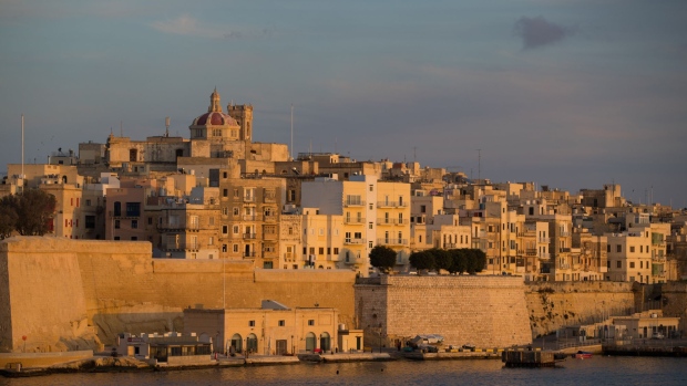 The domed roof of St. Philip's Church stands above waterfront hotels and residential property in Senglea, Malta, on Wednesday, Feb. 1, 2017. It may be smaller than the smallest English county, but Malta provides an insight into the European allegiances that Britain will hit head on after firing the starting gun on Brexit negotiations in coming weeks. 