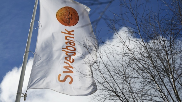 A flag flies outside of the Swedbank AB headquarters in Sundbyberg, Sweden, on Tuesday, March 5, 2019. Shares of Sweden’s oldest bank Swedbank have erased all the gains seen since Chief Executive Officer Birgitte Bonnesen took the helm of the bank in April 2016, after money-laundering allegations wiped out a fifth of its market value. 