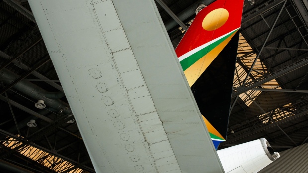 The logo of South African Airways sits on the tailfin of an Airbus Group NV A340-600 aircraft during a live weight saving demonstration at O.R. Tambo International airport in Johannesburg, South Africa, on Tuesday, Feb. 24, 2015. South African Airways is close to a 1.25 billion-rand ($107 million) savings target after renegotiating airline leases and supply contracts, canceling two long-haul destinations and reviewing the route of Washington D.C. flights. 