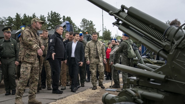 Volodymyr Zelenskiy, Ukraine's president, inspects heavy artillery during an Interior Ministry military drill in Stare, Ukraine, on Monday, Sept. 30, 2019. Fallout from Donald Trump's phone call with Ukraine's leader is reverberating far beyond Washington. Photographer: Evgeniy Maloletka/Bloomberg