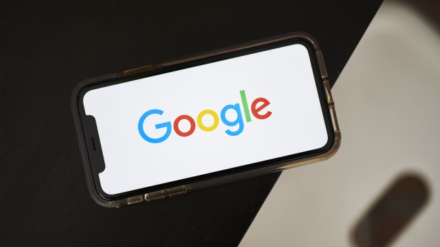 The Google Inc. logo is displayed on an Apple Inc. iPhone in this arranged photograph taken in the Brooklyn borough of New York, U.S., on Friday, July 19, 2019. Alphabet Inc. is scheduled to release earnings figures on July 25. 